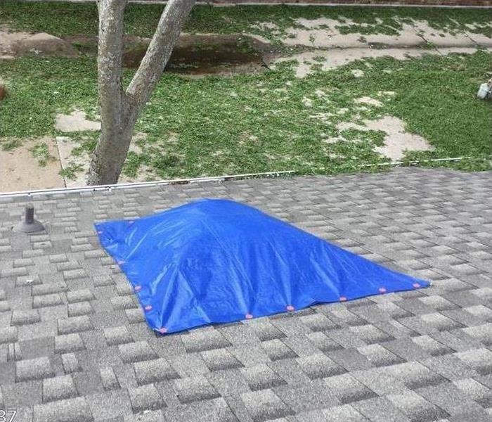 tarp covering broken skylight