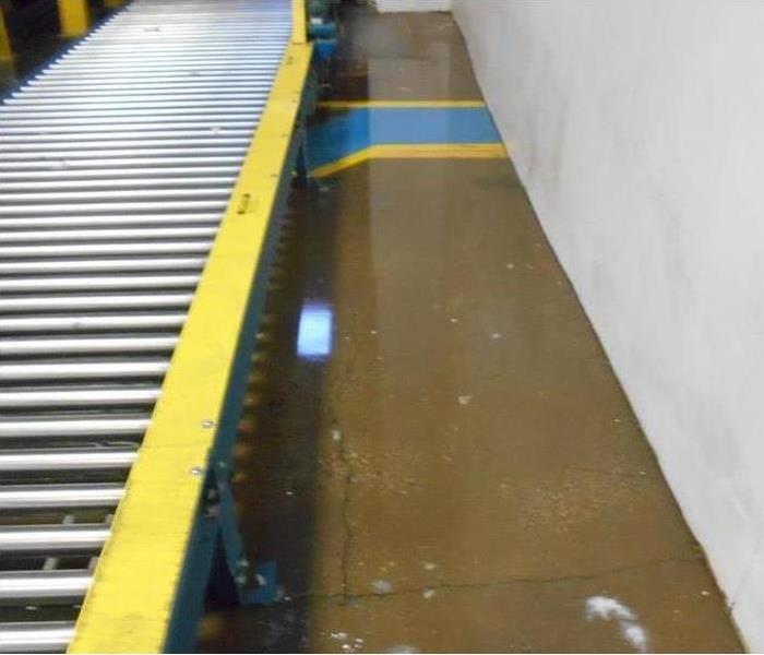 water covering the floor of a warehouse