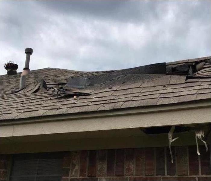 roof of home damaged by fire
